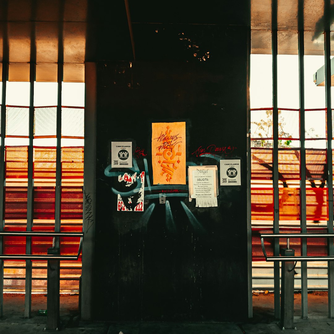 a black door with graffiti on the side of it